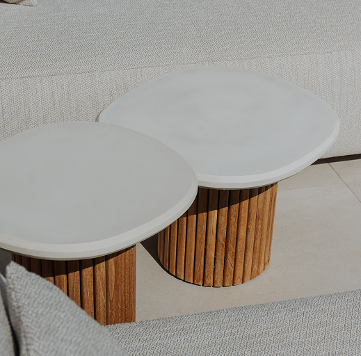 Two organic shaped coffee tables with a stone top and wooden bottom