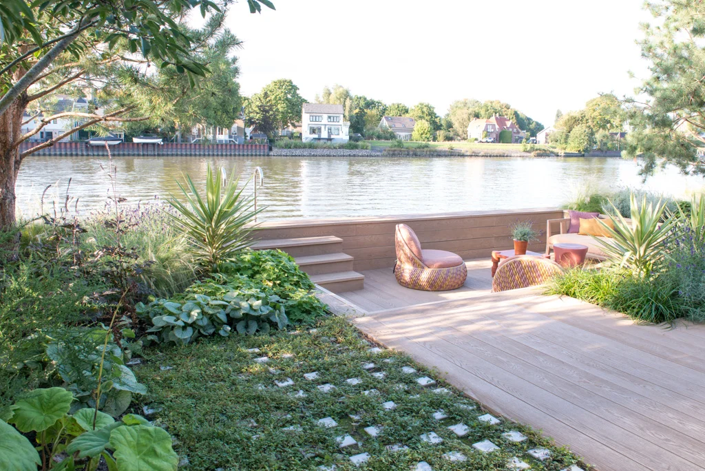 Modern garden with lounge area by the river