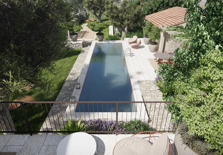 Top view of a rectangular pool surrounded by greenery and patio